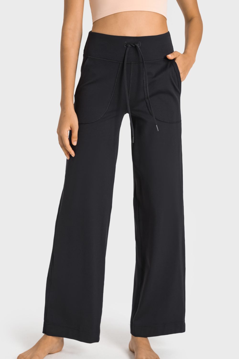 Drawstring Waist Wide Leg Sports Pants with Pockets by Trendsi