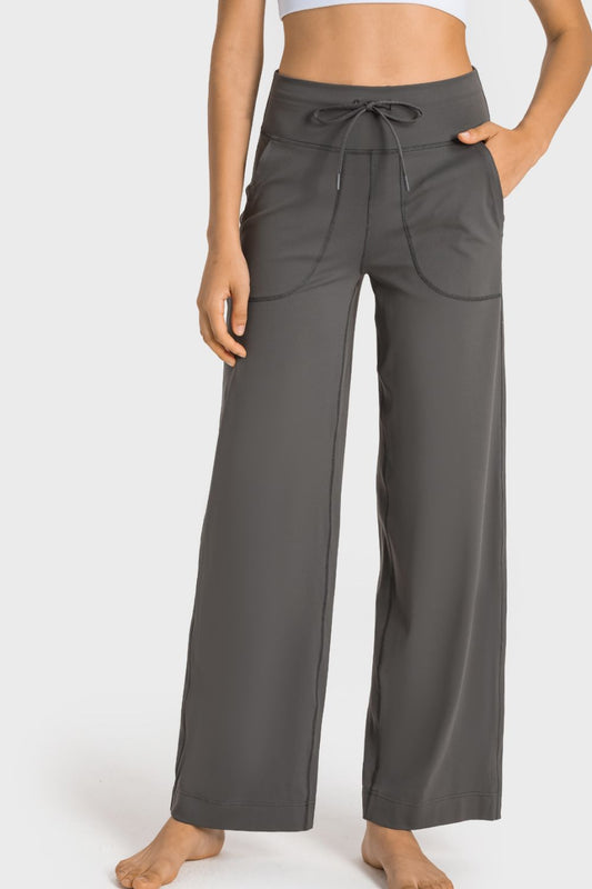 Drawstring Waist Wide Leg Sports Pants with Pockets by Trendsi