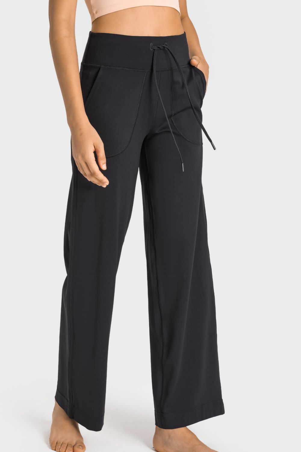 Drawstring Waist Wide Leg Sports Pants with Pockets by Trendsi