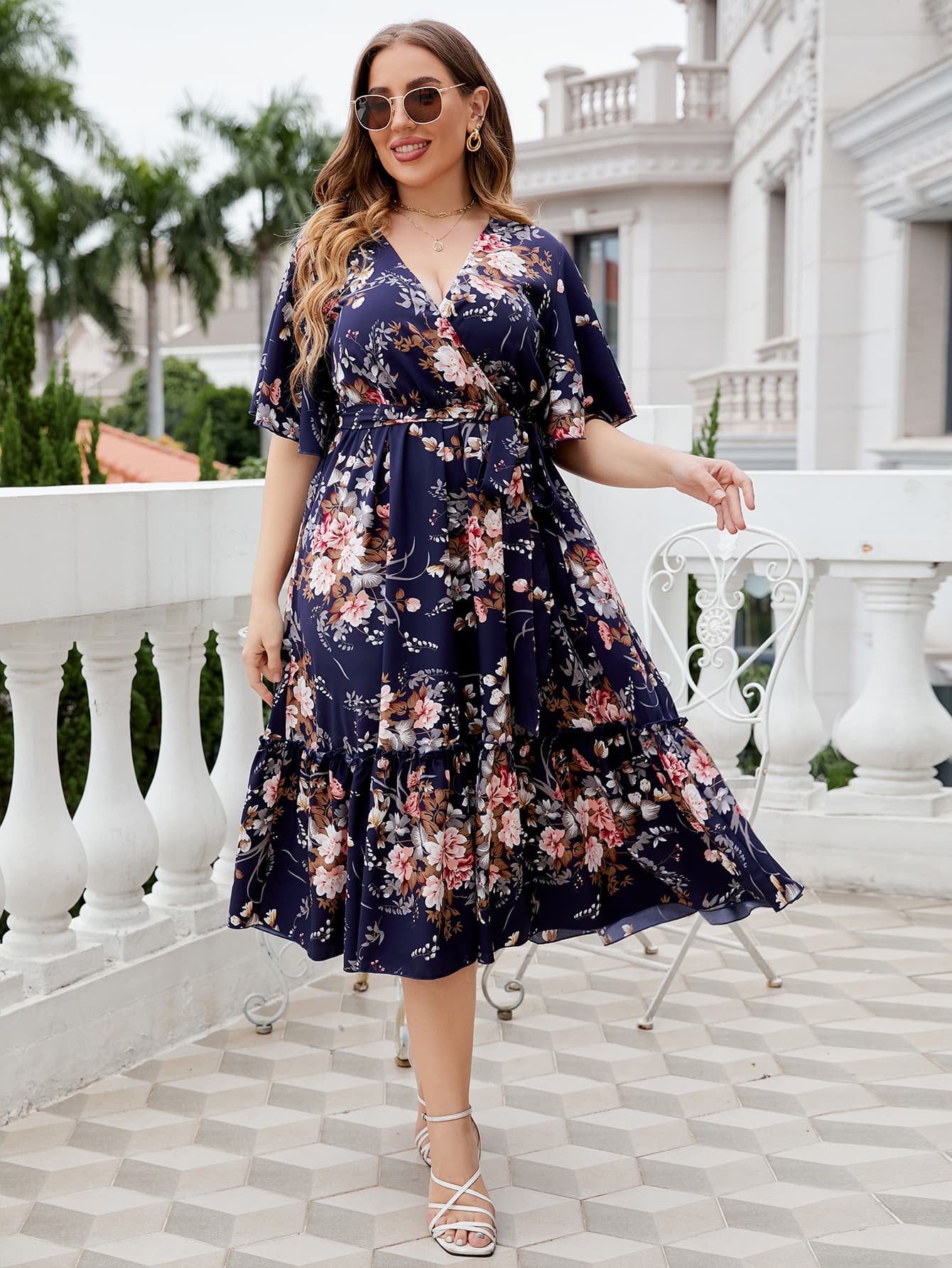 Plus Size Floral Surplice Neck Midi Dress by Trendsi