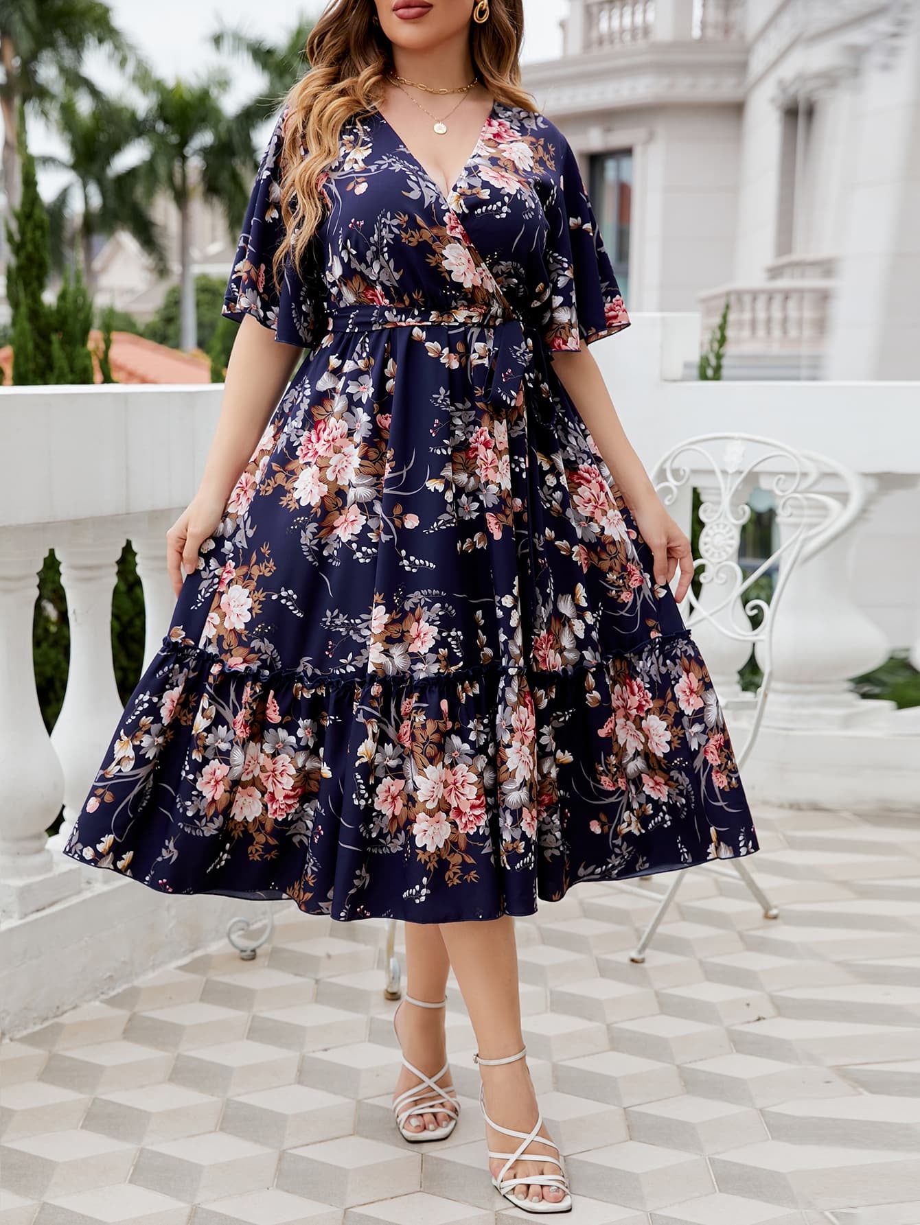 Plus Size Floral Surplice Neck Midi Dress by Trendsi