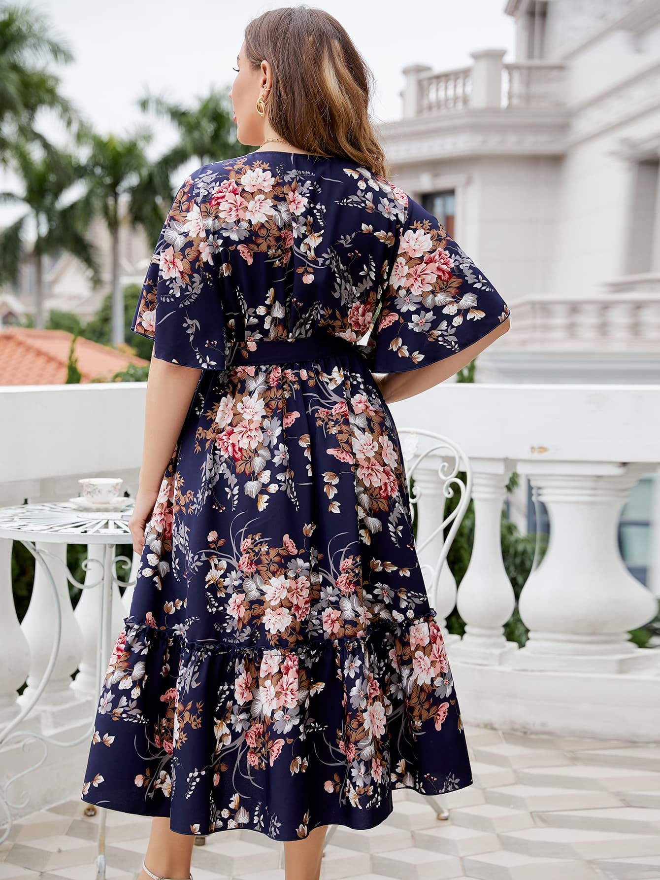 Plus Size Floral Surplice Neck Midi Dress by Trendsi